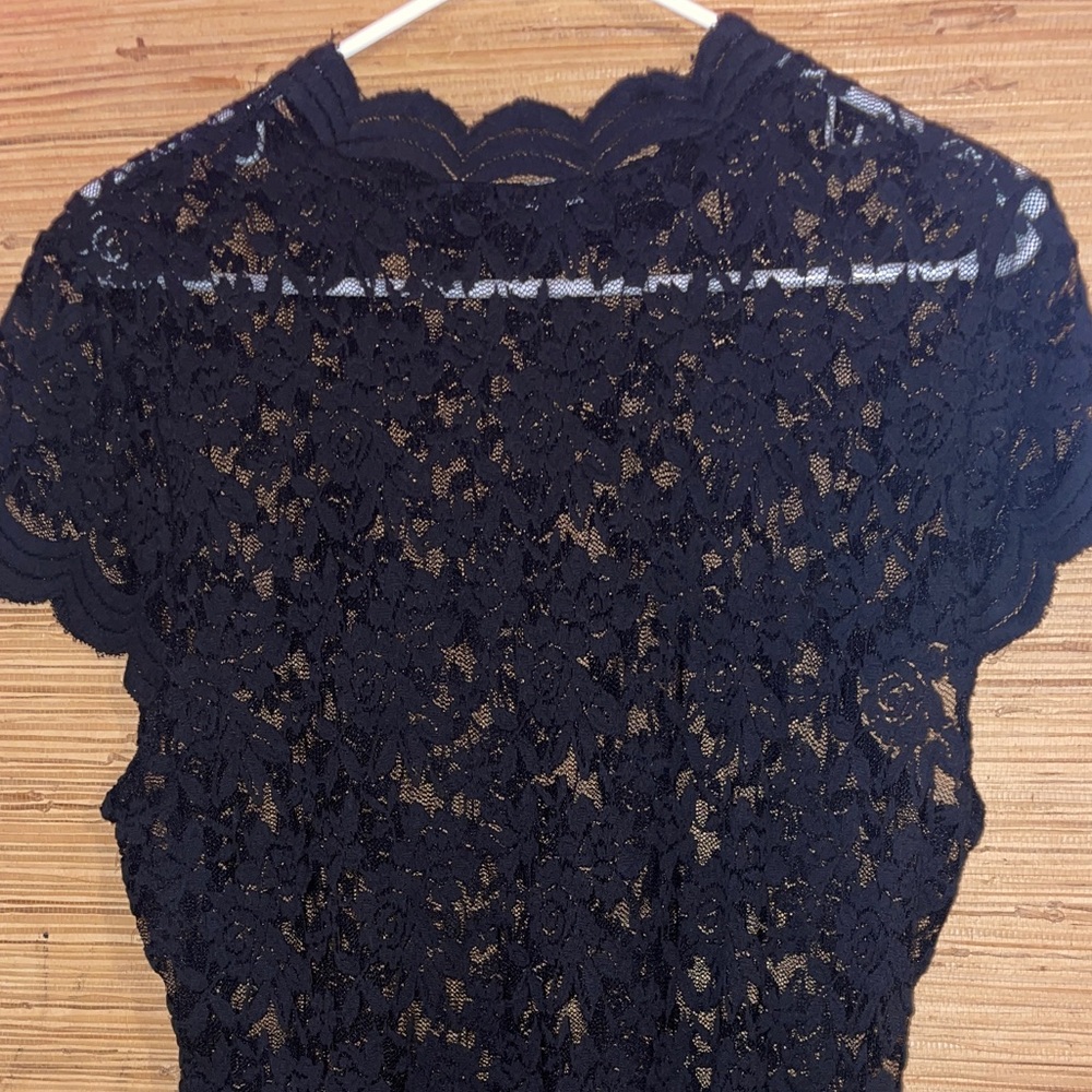Woman’s black Lacey body suit